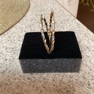 14 kt tri colored hoop earrings.